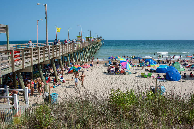 A busy beach scene at Bogue Inlet Fishing Pier